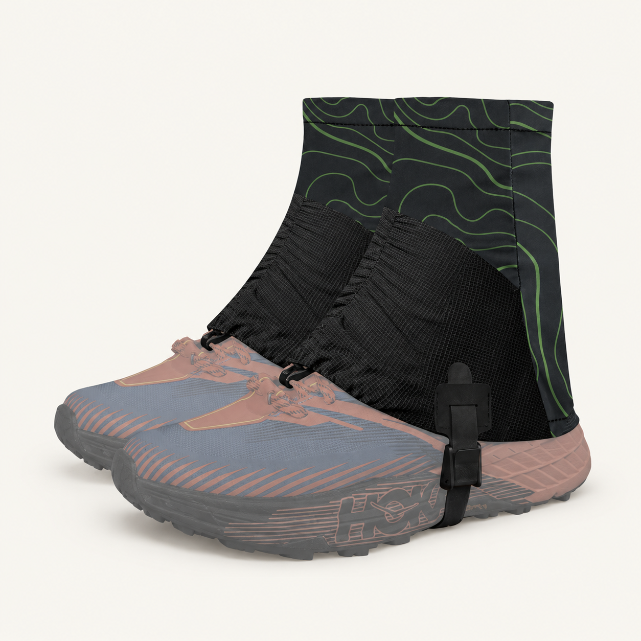 Green contour-pattern gaiters shown over shoes against a warm off-white background